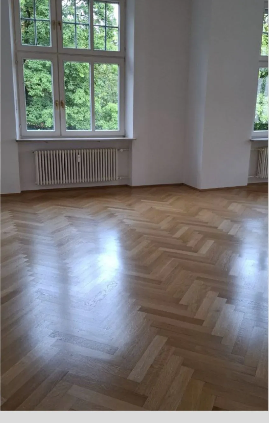 Period flat after move-out cleaning: herringbone parquet and paned windows