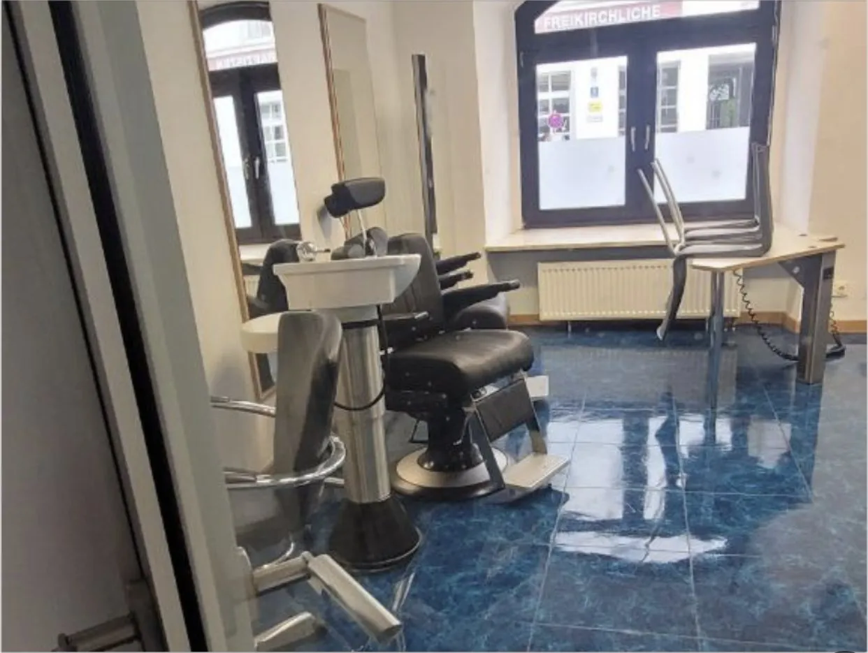 Treatment room with chair and basin after cleaning