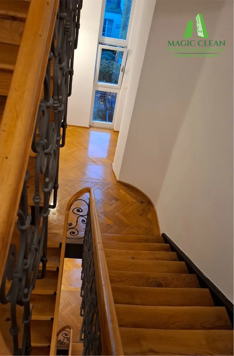 Looking down into the freshly cleaned stairwell with parquet floor