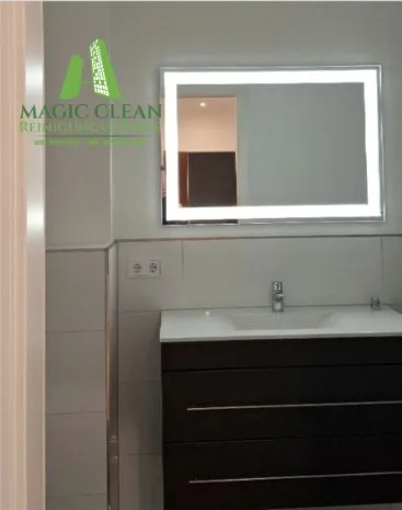 Vanity unit with a lit mirror after cleaning