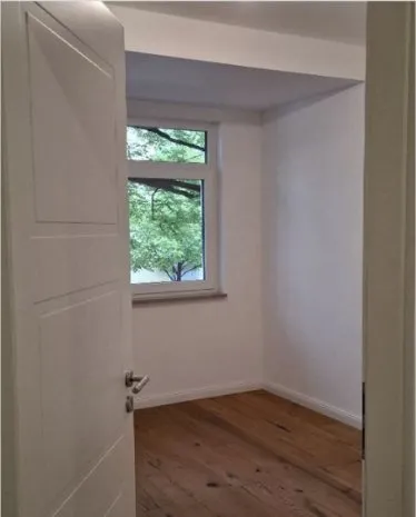 Room after post-renovation cleaning, wooden floor clean